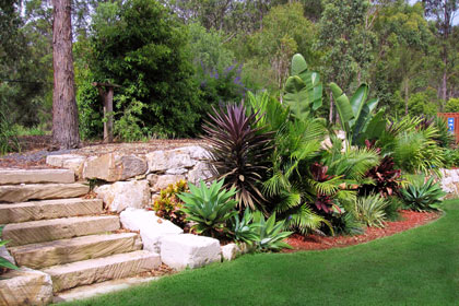 Sculptured garden with  retaining wall made from sized sandstone